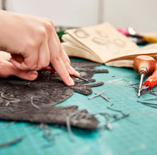 Load image into Gallery viewer, Fabia carves a bespoke floral block for John Lewis