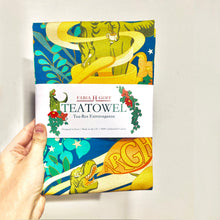 Load image into Gallery viewer, T-Rex Extravaganza Tea Towel – Playful Prehistoric Charm with a Cosmic Twist