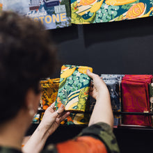 Load image into Gallery viewer, T-Rex Extravaganza Tea Towel – Playful Prehistoric Charm with a Cosmic Twist