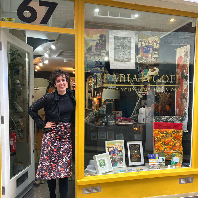 Fabia proudly stands in the doorway of her first solo shop and open studio