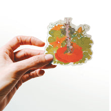 Load image into Gallery viewer, Hand holding a colorful sticker with a design of a person surrounded by flowers on a white background
